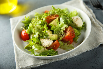 Healthy avocado salad with mozzarella cheese