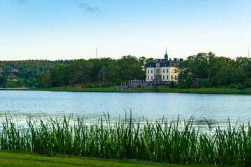 View of an old swedish mansion over the water.
