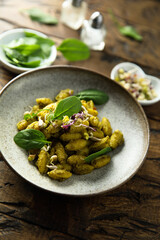 Homemade pasta with spinach pesto