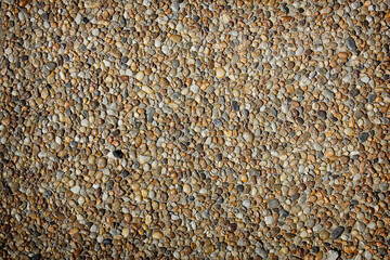 background of small pebbles in close-up. A surface of small pebbles