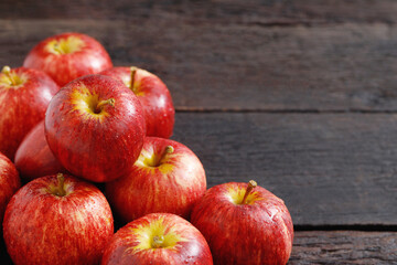 fresh red apples on the wooden floor