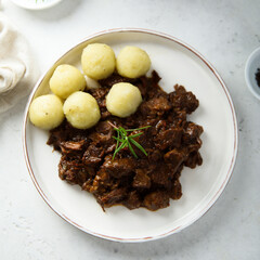 Homemade beef ragout with potato dumplings