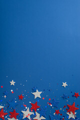 Vertical view from the top featuring patriotic party supplies.Glitter stars, and sparkle confetti...