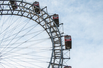 Close up of a ferris wheel in Prater, Vienna with blue sky in the background