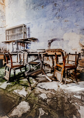 Fototapeta na wymiar Junk Room Full Of Abandoned Broken Furniture