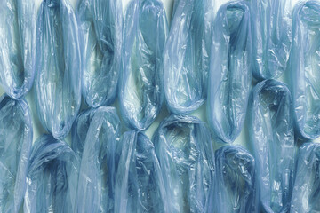 Background from blue used disposable plastic bags for food, texture from Polyethylene packets. Waste reduction, Environmentally friendly concept, recycling, disposable and zero waste