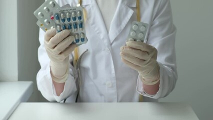 Female doctor showing different pills at clinic. Health care, pharma, medicine concept