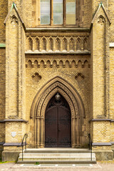 Old medieval wooden church door.
