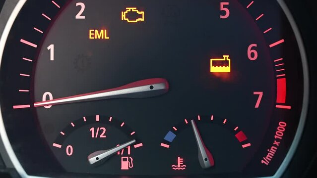 Dashboard lights in car. Yellow warning lights in vehicle. Problems with engine and cooling system. Warning light symbols. Check engine light on. 