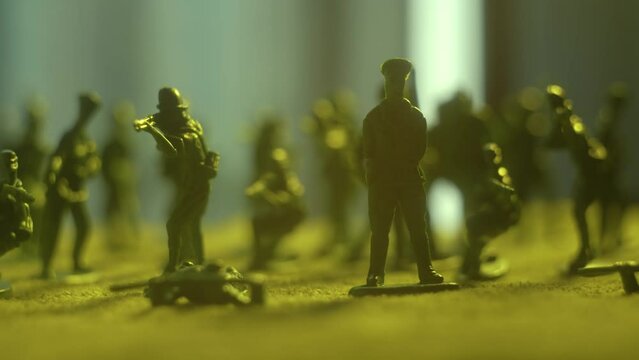 Moving shot of toy military troops. Violence war resistance and peace without armored invasion