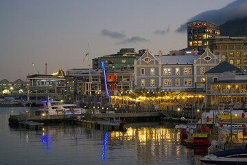 Fototapeta na wymiar Victoria and Albert waterfront and harbor at sunset, Cape Town, South Africa