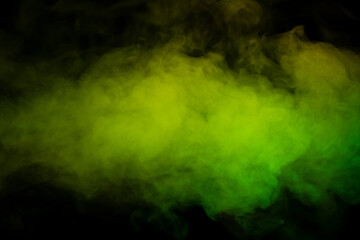 Yellow and green steam on a black background.
