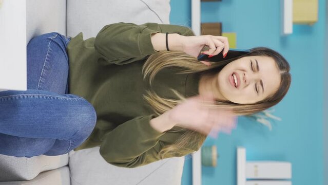 Vertical Video of Teenage girl making a quarrelsome and stressful phone call.
