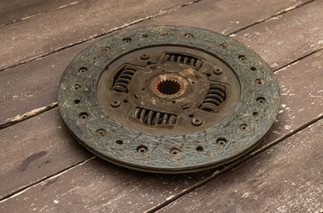 Disassembled clutch disc of a car in a car service repair shop