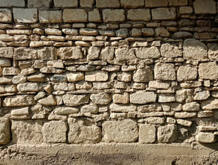 old stone wall in sunlight