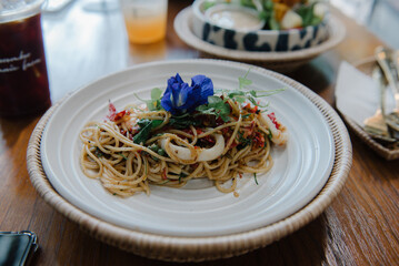 Spicy Seafood Spaghetti is a popular Thai dish that is a fusion of Italian pasta and Thai cuisine. 
