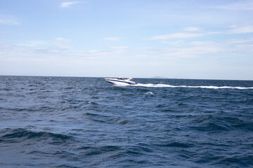 Naklejka na ściany i meble Speed boat on the sea. Blue ocean summer