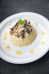 rice with mushrooms risotto healthy meal food snack on the table copy space food background rustic top view keto or paleo diet veggie vegan or vegetarian food no meat