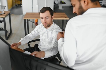 Two diverse crypto traders brokers stock exchange market investors discussing trading charts research reports growth using pc computer looking at screen analyzing invest strategy, financial risks.