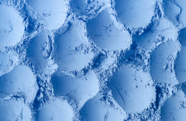 Light blue bentonite facial clay powder (alginate modeling mask, eye shadow, body wrap) texture close up, selective focus. Abstract background with brush strokes.