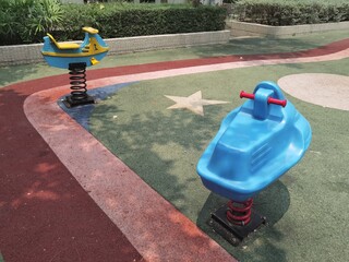 Children's playgrounds in the park, swings and slides for children to play.