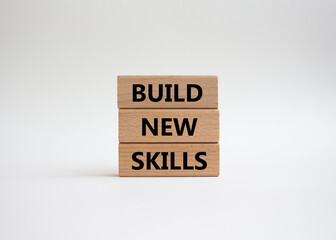 Build New skills symbol. Concept word Build New skills on wooden blocks. Beautiful white background. Business and Build New skills concept. Copy space
