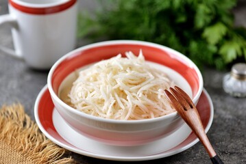 Black radish salad with white vinegar and olive oil. Healthy food