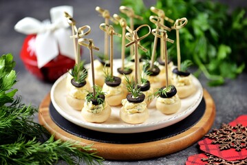 Pickled champignons stuffed with cheese, boiled eggs, garlic and olives