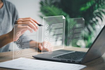 Electronic document management and Paperless workplace concept, Women checking on e-document check sheet and use laptop online survey online exam Choosing the right answer in the example on virtual