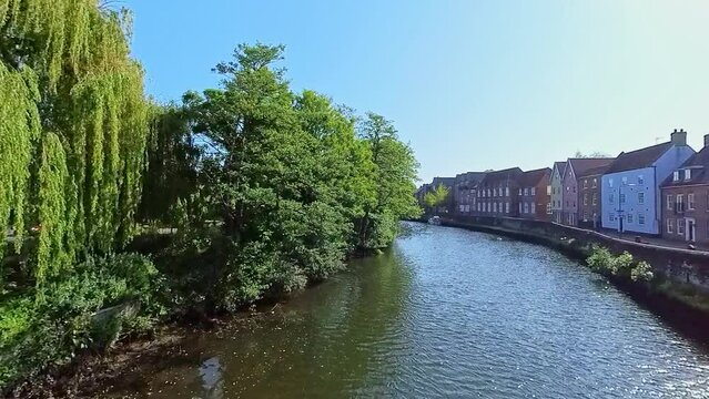 shot across the River Wensum and the historic Quayside in the city of Norwich. Captured on a bright and sunny morning from the historic Fye Bridge
