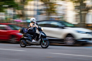 Fast riding scooter with motion blur.