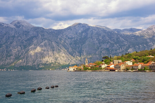 Beautiful Mediterranean landscape. Montenegro, Adriatic Sea. View of Bay of Kotor and Stoliv town on cloudy spring day