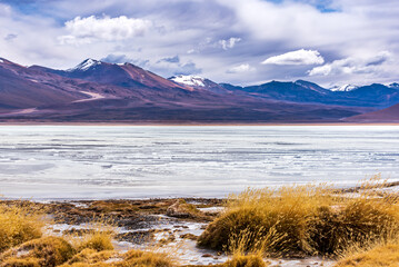 Beautiful view of mountains range and frozen lake in the bolivian plateau