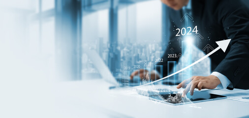 businessman new year business goals 2024, positive indicators 2024, company competitiveness on...
