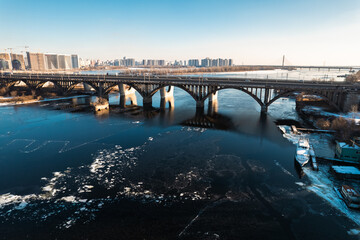 Fototapeta na wymiar Drone view of the New Darnytskyi Bridge and the Dnipro River in Kyiv.