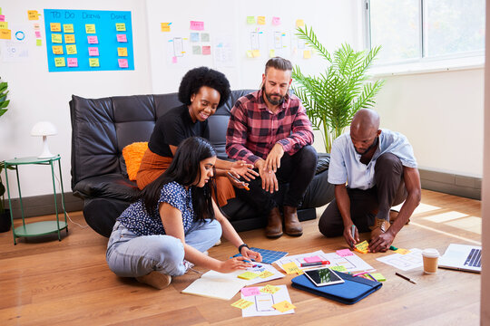 Scrum team brainstorms for mobile app idea, UX design and planning development
