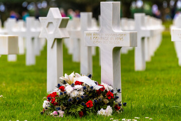 a tombstone of an unidentified soldier during the d-day battle in Normandy France