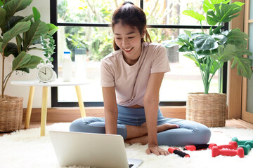 The asian woman do exercise at home in holiday time, on modern concept and healthy. Nature  background with exercise and nature, female happiness concept