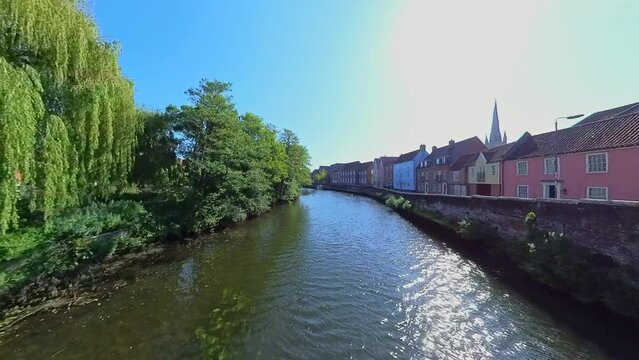 Shot across the River Wensum and the historic Quayside in the city of Norwich. Captured on a bright and sunny morning from the historic Fye Bridge