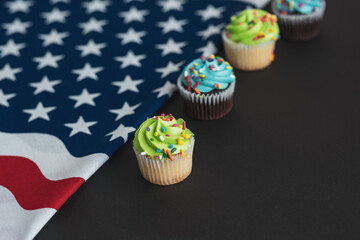 Independence Day 4th of July. Congratulations background. American Constitution Day. Postcard in the American tradition. Cupcakes decorated with symbols of America