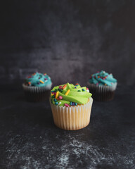 On a textured dark background, cakes.Celebration