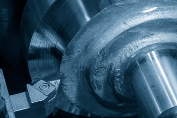 Closeup scene the lathe machine finish cut the brass parts by lathe tools.