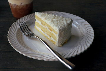 slice of cream cake on a white
plate