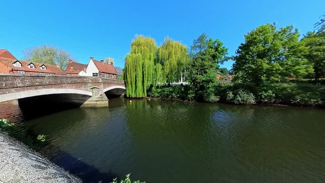 The historical Fye bridge over the River Wensum in the city of Norwich. Captured on a bright and sunny morning