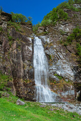 Obraz premium A waterfall in the Maggia Valley, one of the largest valleys in the Canton Ticino, near the town of Ascona, Switzerland - May 2023