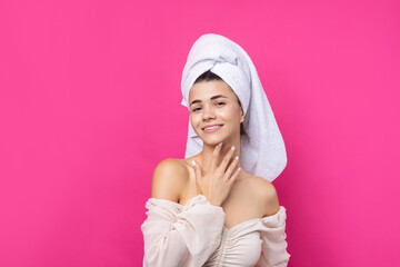 Portrait of young beautiful woman after bath. Beauty face of a cheerful attractive girl with towel...
