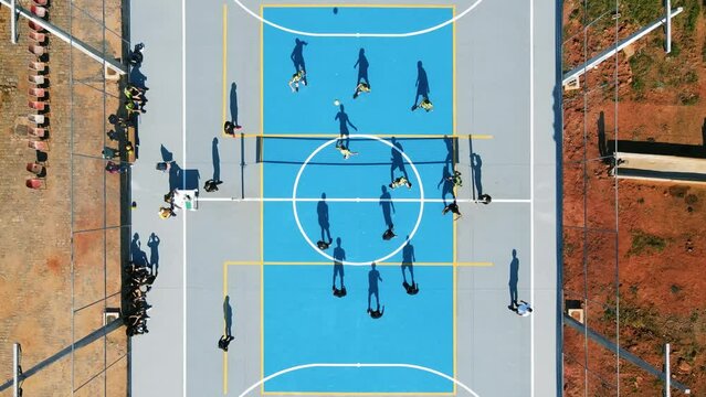 A unique aerial view of a volleyball game during the day. 4k resolution