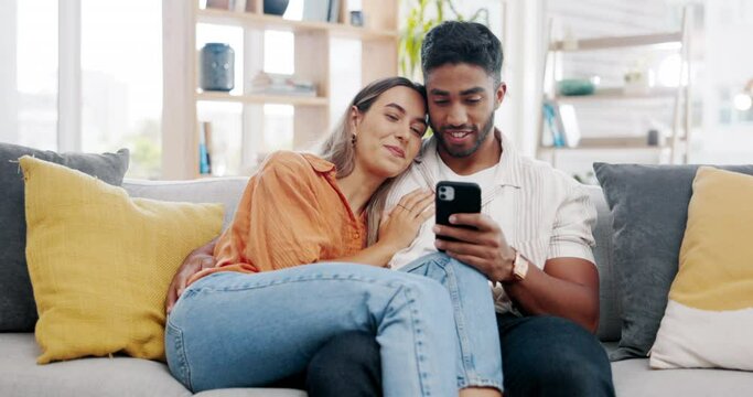 Couple, smartphone and relax on sofa with social network app, blog or video with communication in home. Man, woman and phone on couch with hug, conversation or reading with love, web chat or internet