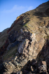 Surreal and beautiful cliffs at Perranporth Beach during low tide.