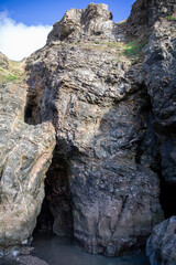 Surreal and beautiful cliffs at Perranporth Beach during low tide.